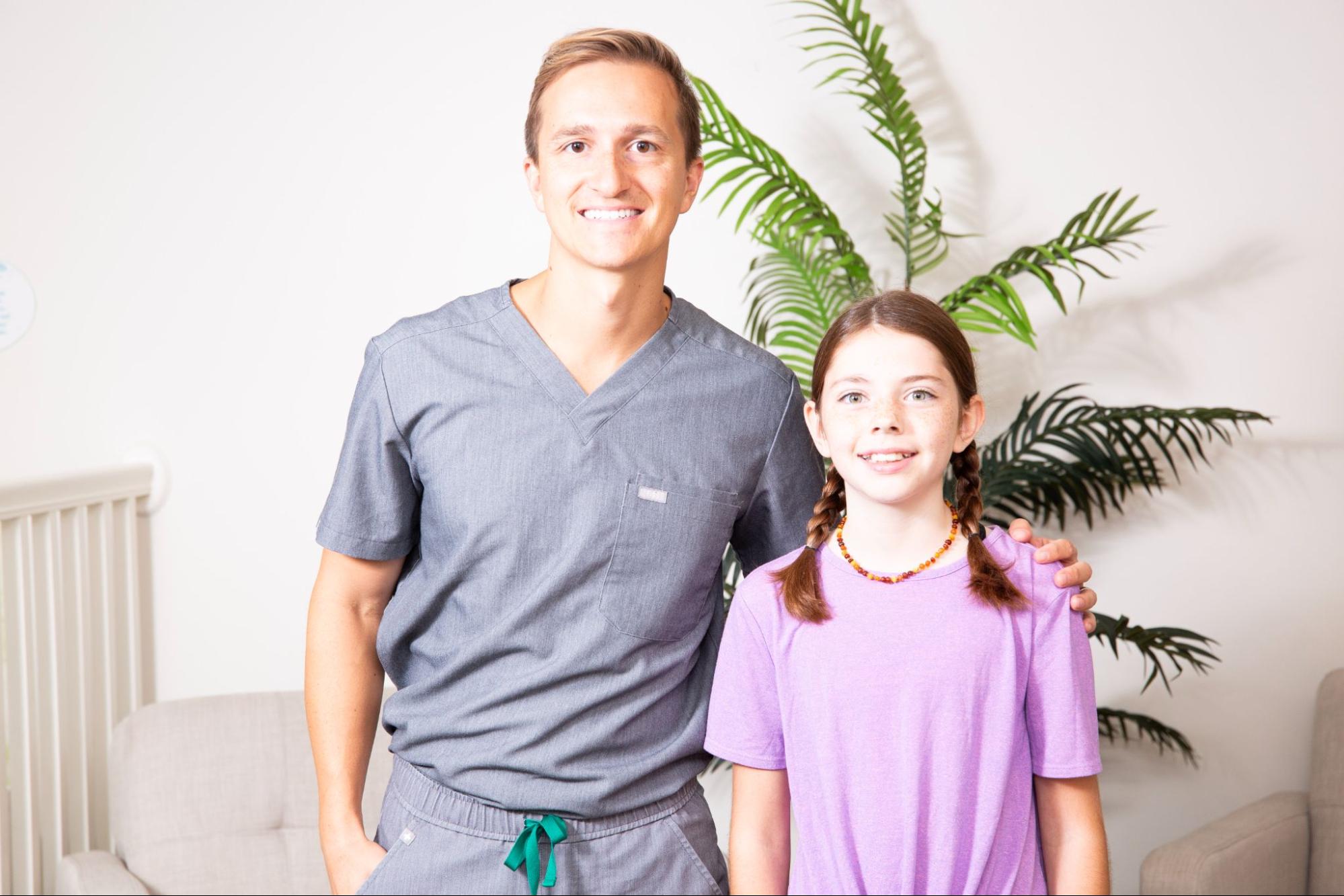 Andrew Pedersen with a young female patient getting Hanover PA orthodontics.
